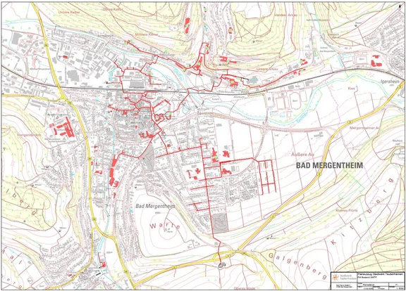 Fernwärmenetz Kartenausschnitt von Bad Mergentheim: Stadtgebiet mit hervorgehobenen Gebäuden in rot. Die roten Gebäude zeigen, welche Bereiche in Bad Mergentheim bereits mit Wärme erschlossen sind.